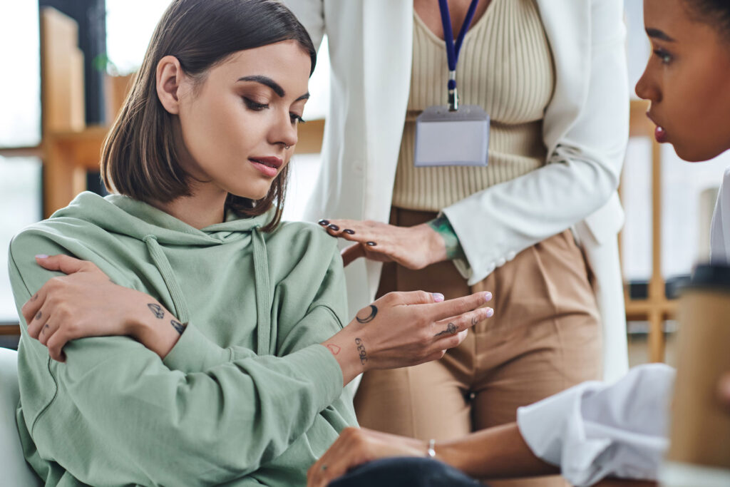 Psychologist calming a woman.