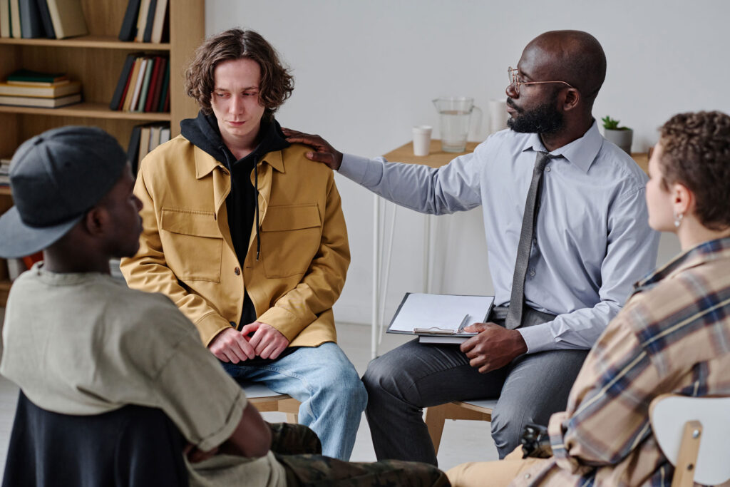 Psychologist talks to his patients.