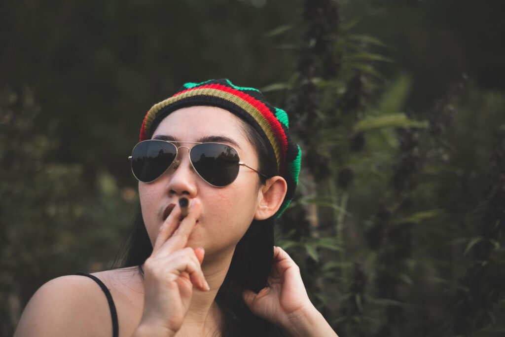 Woman smoking a marijuana.