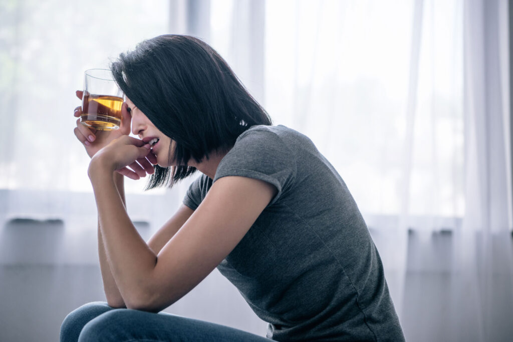 Lonely woman with alcohol addiction.